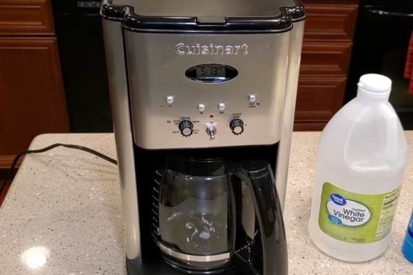 Pour enough water into the basin and mix in the vinegar, soap